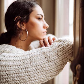 Woman looking out of a window