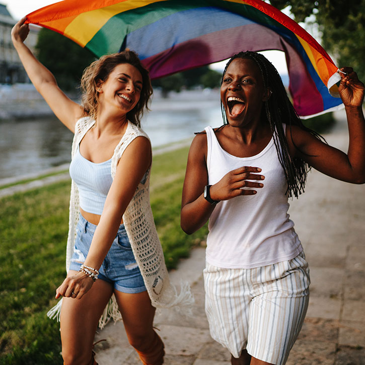 Two female friends running